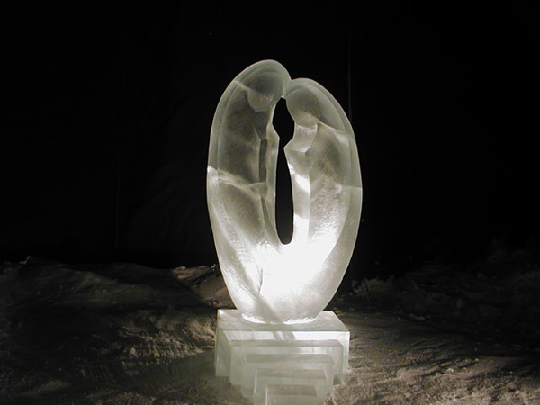 Ice Sculpture “Love” by Qifeng and Zhe An, completed, at night lit with white light.